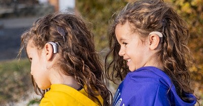 With cochlear implants, 7-year-old twins embrace school, play and life