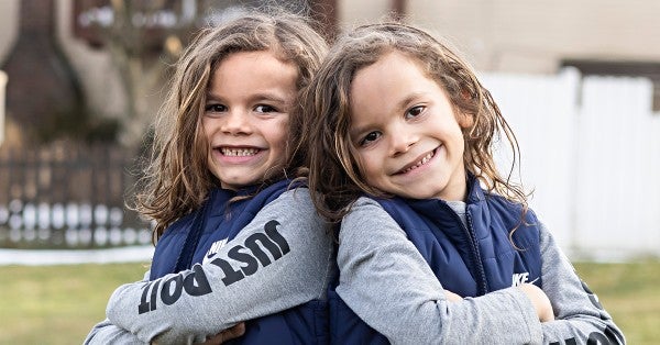 With cochlear implants, 7-year-old twins embrace school, play and life.