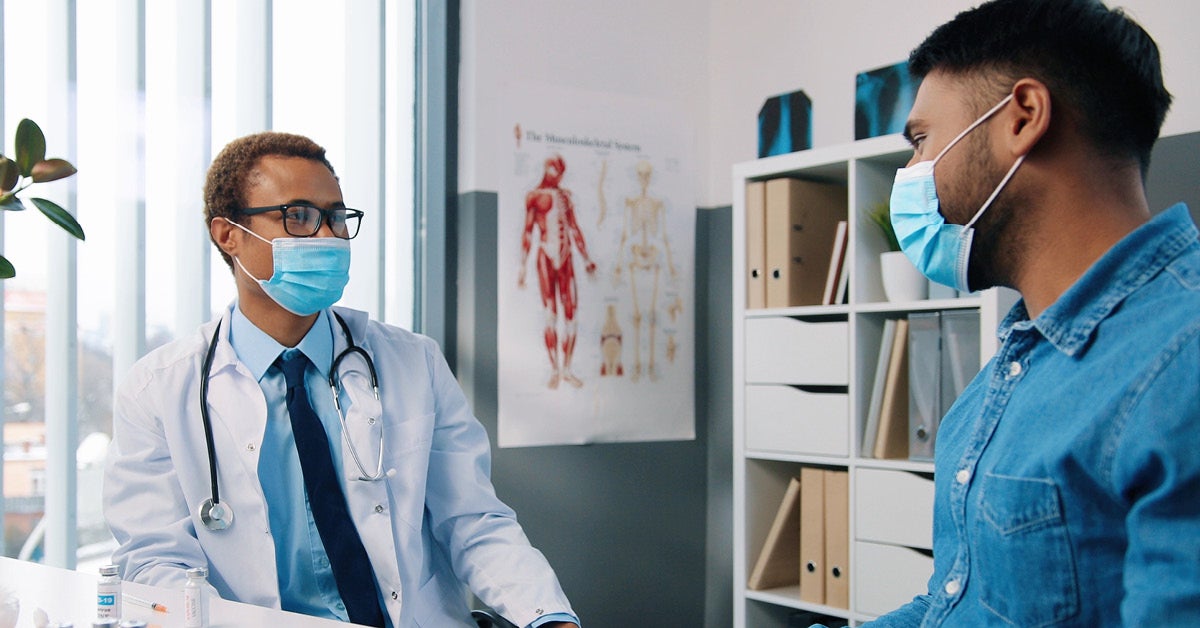 doctor and patient wearing masks