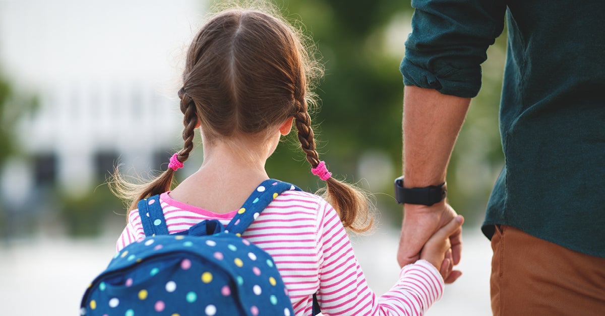 child holding fathers hand