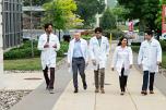 Clinicians in the LVHN Graduate Medical Education Residency and Fellowship walking together outside at Lehigh Valley Hospital-Cedar Crest.