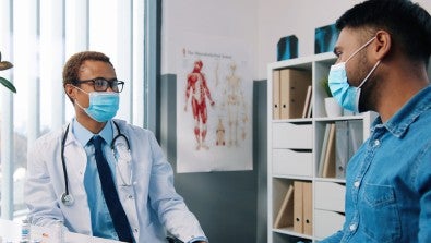 doctor and patient wearing masks