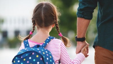 child holding fathers hand