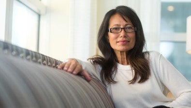 Woman sitting on sofa - LVHN
