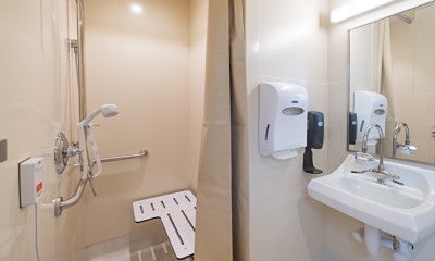 All rooms include a private bathroom with built in shelves and a retractable shower chair.