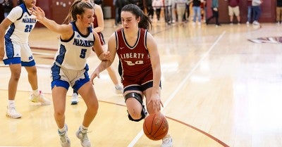 Liberty High School basketball co-captain Emma Pukszyn tore a knee ligament in April 2023. Eight months later, she was back playing again for the Hurricanes.