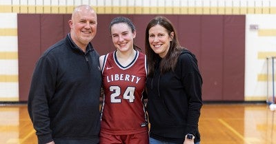 Liberty High School basketball co-captain Emma Pukszyn tore a knee ligament in April 2023. Eight months later, she was back playing again for the Hurricanes.