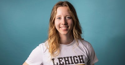 Lehigh University’s Josie Charles bats in softball game hours after wide-awake hand surgery.