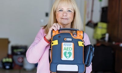 An AED is an automated external defibrillator, a small compact device that can help save someone’s life during sudden cardiac arrest. 