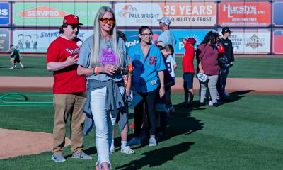 Lori Alfonse, DO, helps throw the first pitch at IronPigs Cancer Survivor Night 2026.