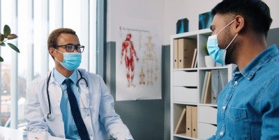 doctor and patient wearing masks