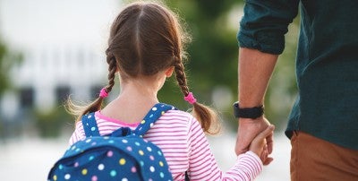 child holding fathers hand
