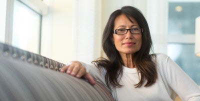 Woman sitting on sofa - LVHN