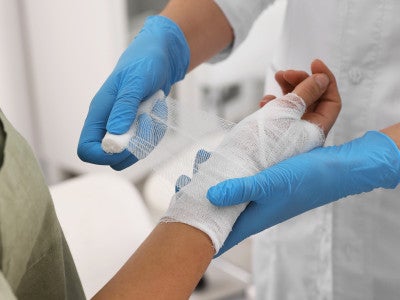 Clinician caring for patient