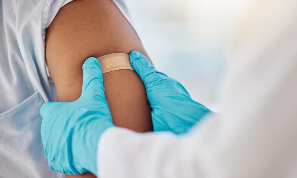 Person receiving flu shot.