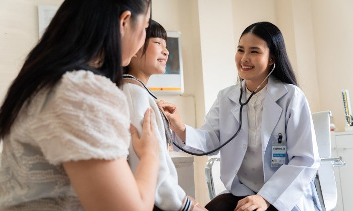 Physician with patient and parent