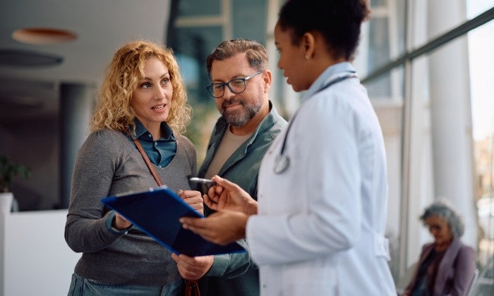 Physician with two patients