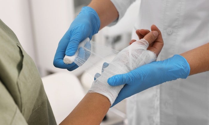 Clinician caring for patient