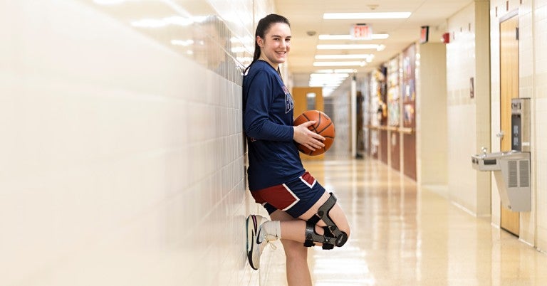 Liberty High School basketball co-captain Emma Pukszyn tore a knee ligament in April 2023. Eight months later, she was back playing again for the Hurricanes.